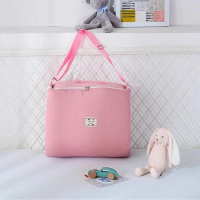 reducteur de lit sac portable rose