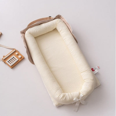 reducteur de lit pour bebe creme