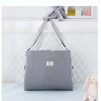 reducteur de lit sac portable gris